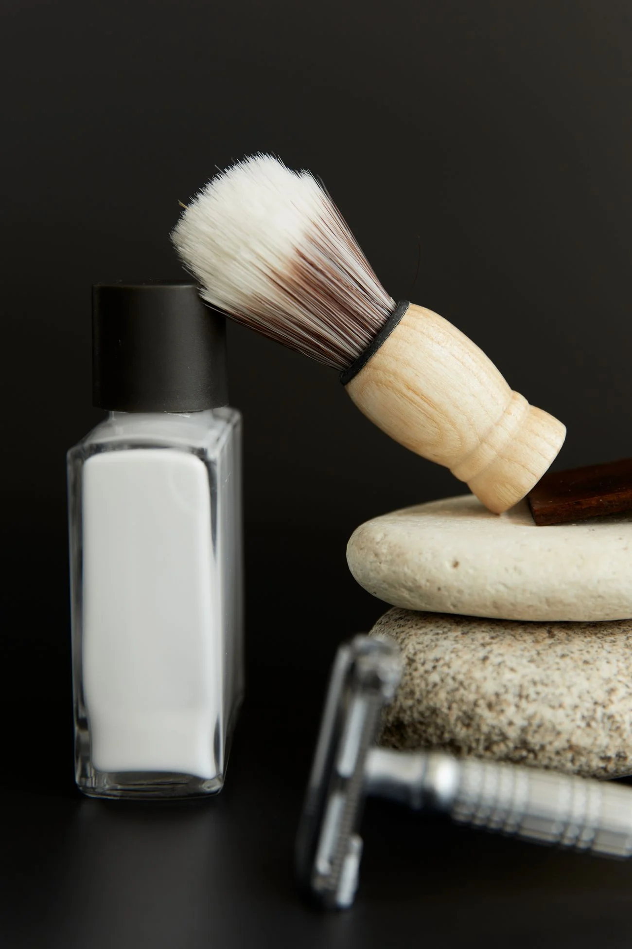 Stock still life of a shaving brush and grooming tools