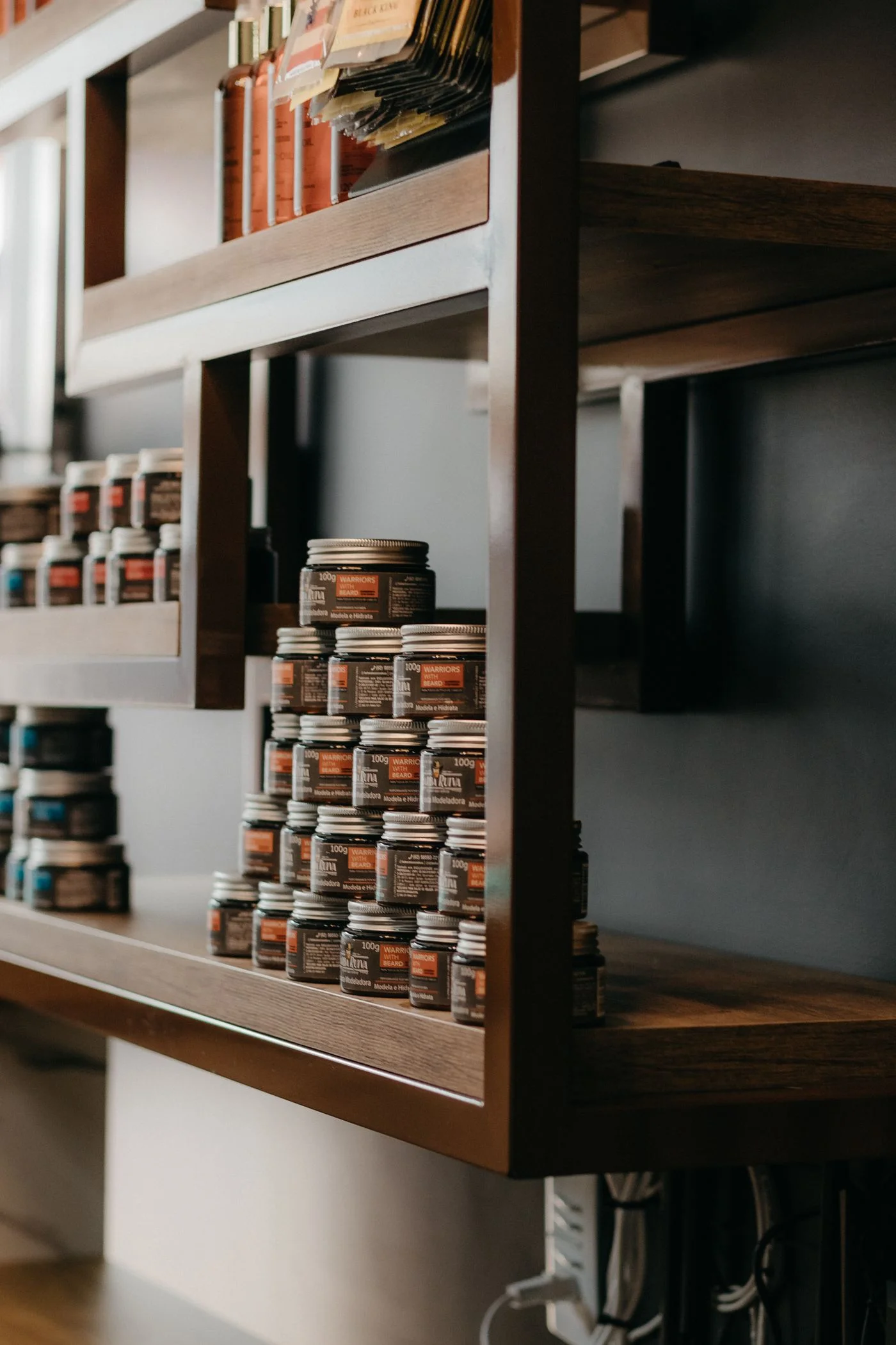 Illustrative real photograph of a barbershop product shelf