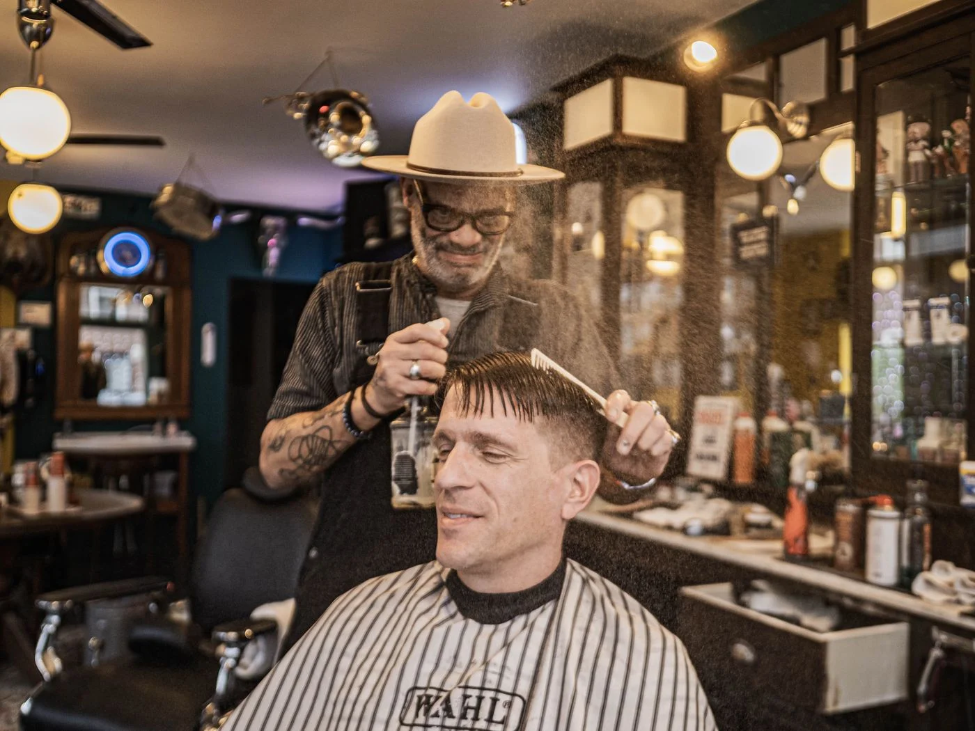 Barber working with a client