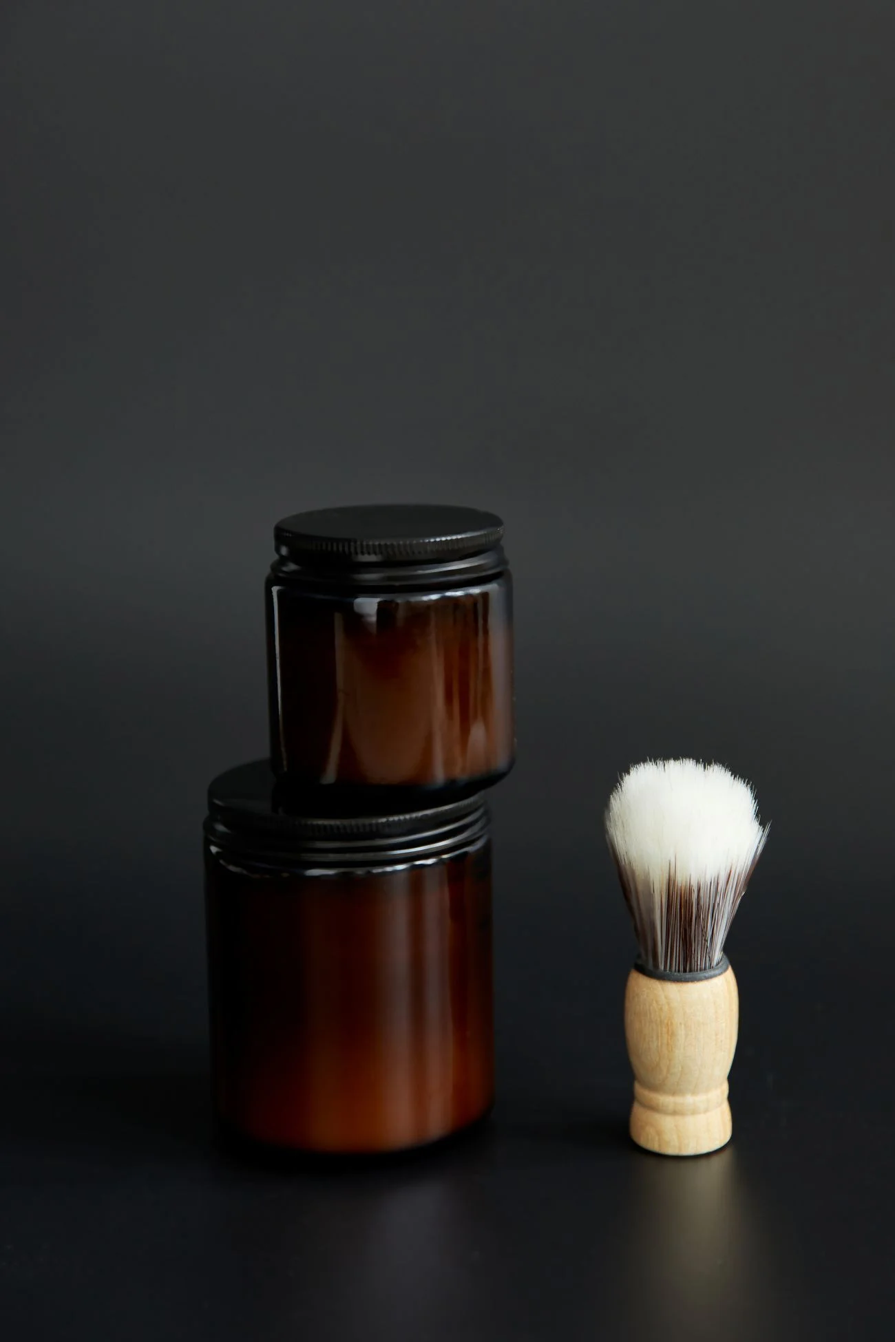 Stock still life of grooming jars and a shaving brush