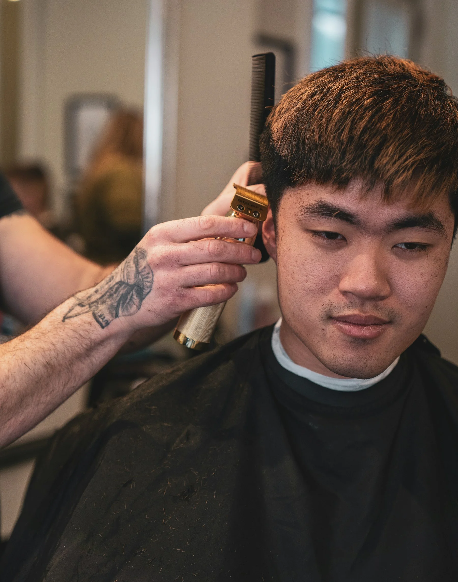 Barber at work on a haircut